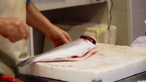 FISHMONGER CLEANING FISH Video stock 160629093