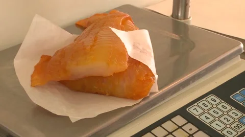 A fishmonger wraps fish Stock Footage 47327534