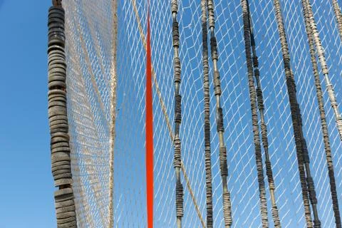 Fishnet drying in the wind Stock Photos