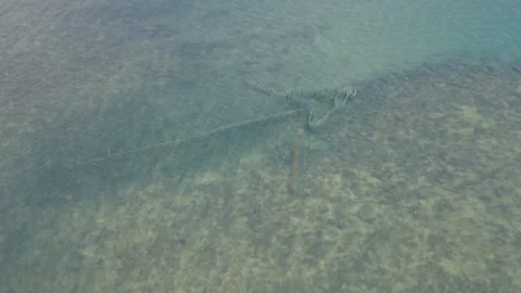 Fishnet top-down drone shot in sea Stockbeeldmateriaal 345053774