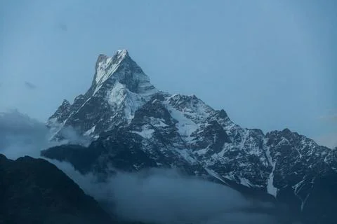Fishtail Machapuchare summit surrounded by clouds, Nepal Foto stock