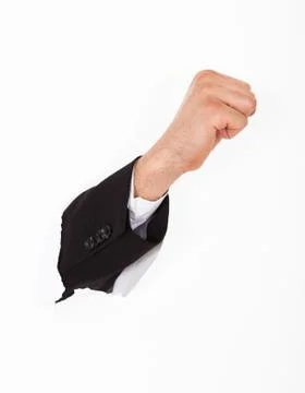 Fist breaking through white wall Stock Photos