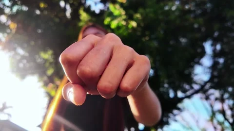 Fist Bump Hand Gesture Slow Motion Front View Low Angle Close Up Outdoors Stock-Footage 323272301