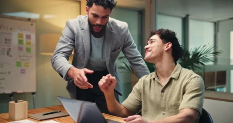 Fist bump, laptop and web design with business people in office at night for Stock Footage 312409518