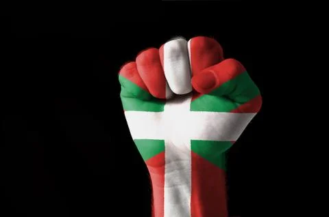 Fist painted in colors of basque flag Stock Photos