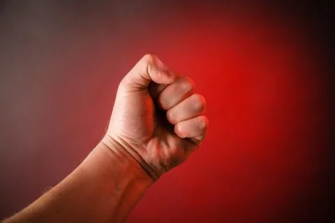 Fist on red background Stock Photos