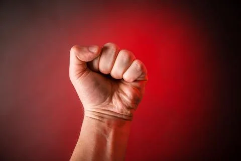 Fist on red background Stock Photos