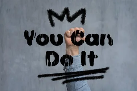 Fist with You Can Do It text. Motivational message and empowerment concept. Stock Photos