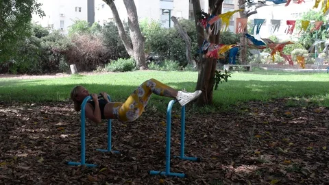 Fit blonde workout with parallel bars Stock Footage 115933407