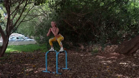 Fit blonde workout with parallel bars Stock-Footage 115933733