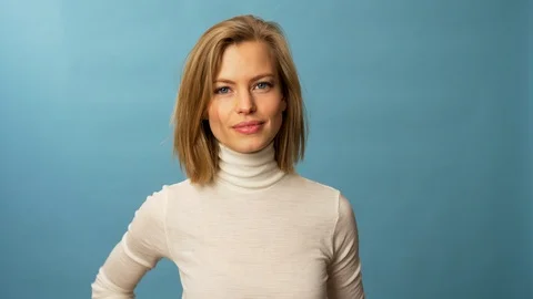 Fit classy model wearing white turtleneck and white framed glasses Stock Footage 103628048