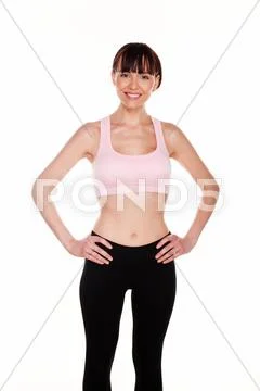 Fit curvy woman with hands on hips Stock Photos