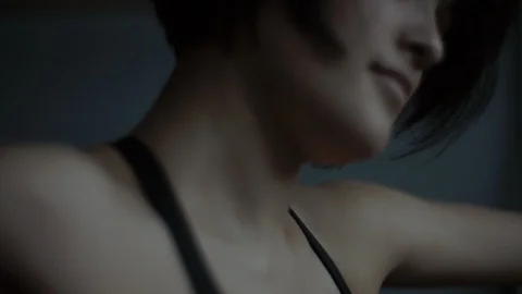 Fit dancer turns away from camera on the floor warming up and stretching Video stock 104273809