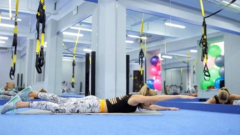 Fit girl is doing  exercises for the back Stock Footage 105344935