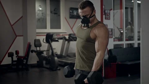 Fit guy in gym with mask Stock Footage 146090477