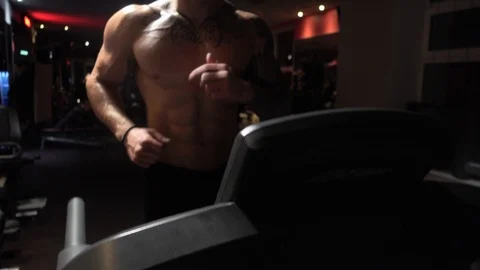Fit guy in gym on treadmill Stock Footage 118859063