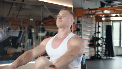 Fit man doing bent-over rows in the gym at workout. Video stock 149982955