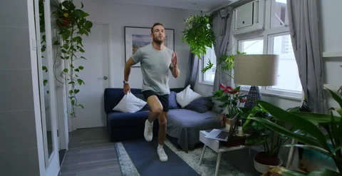 Fit Man Doing Online Work Out In His Living Room Stock Footage 147176580