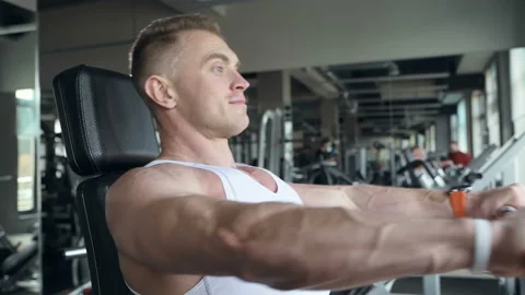 Fit man doing push ups at machines in the gym. Stock Footage 149983678