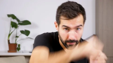 Fit man exercising at practicing box at home Stock Footage 95641279