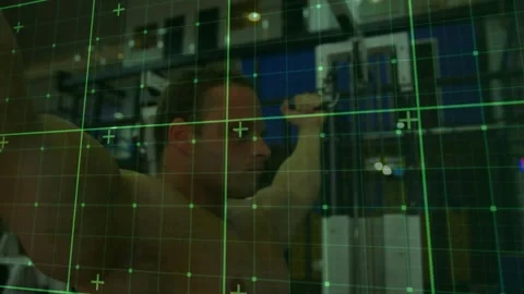 Fit man gripping handles, doing pulldowns for strength in fitness gym, green Stock Footage 330894818