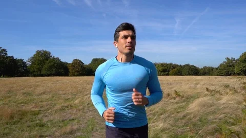 Fit Man Jogging in Slow Motion Stock Footage 96047355