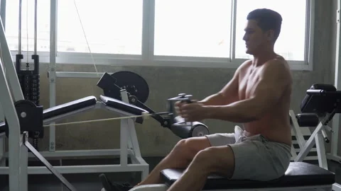 fit man shirtless exercises with rowing... | Stock Video | Pond5
