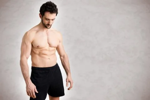 Fit Man Standing Looking Down Stock Photos