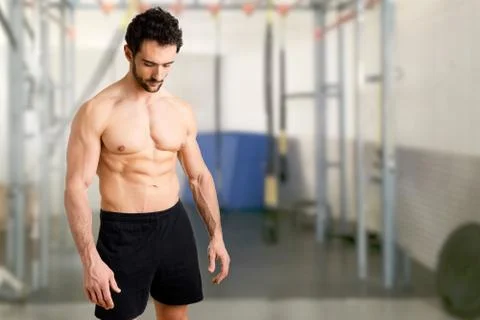 Fit Man Standing Looking Down Stock Photos