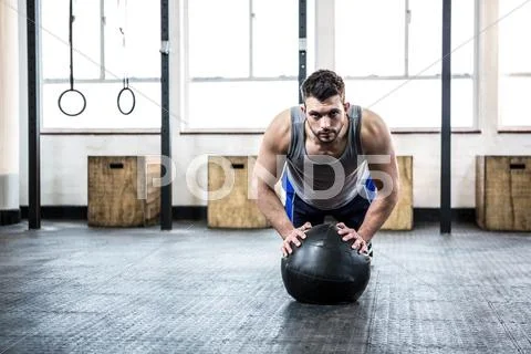 Fit man working out with ball Stock Photos