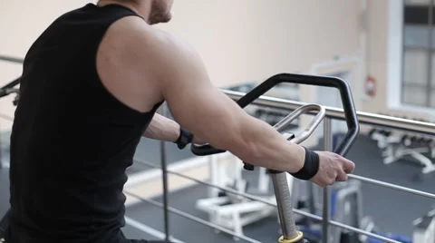 Fit man working out on exercise bike at the gym Video stock 62561749