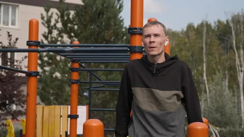 Fit Man Working Out on Parallel Bars Outdoors Stock Footage 160203274