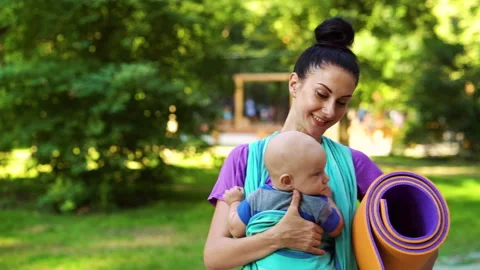 mom carrying baby