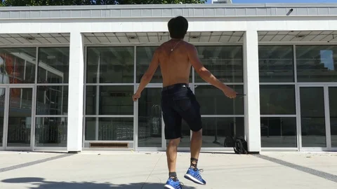 Fit nale jumping rope summer street Stock Footage 79504433
