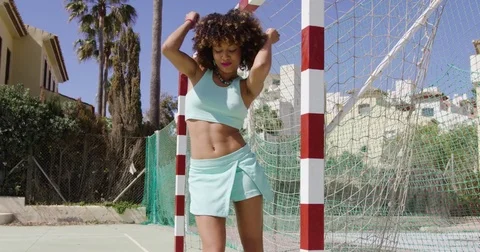 Fit smiling female on playground Stock Footage