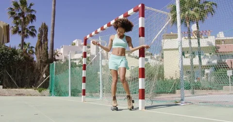 Fit smiling woman in roller skates Stock Footage