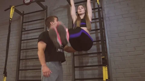 Fit sportive man and woman doing exercise training back and press muscles Stock Footage
