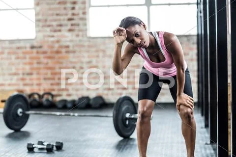 Fit tired woman face to the camera Stock Photos
