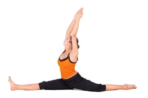 Active athletic woman practicing one leg up yoga pose Stock Photo