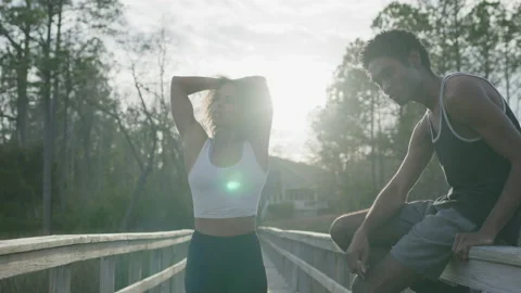 Fit Young Couple Preparing for a Run Outside Video stock 208785917