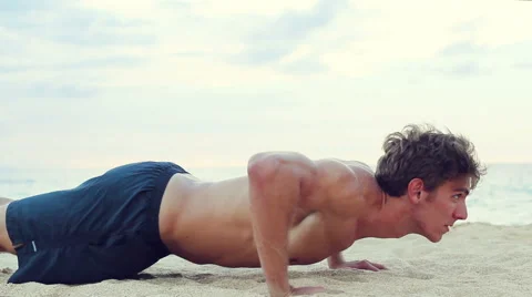 Fit Young Man Exercising on Beach. Crossfit Work Out. Healthy Active Lifestyl 動画素材 54144810