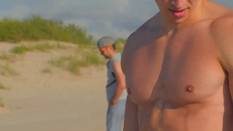 Fit Young Man Exercising on Beach. Video stock 84041935