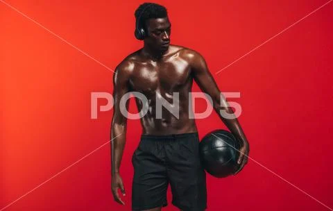 Fit young man with medicine ball Stock Photos