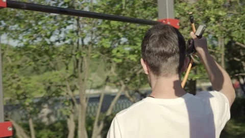 Fit young man preparing for exercising with gym equipment outdoor Stock Footage 146307459