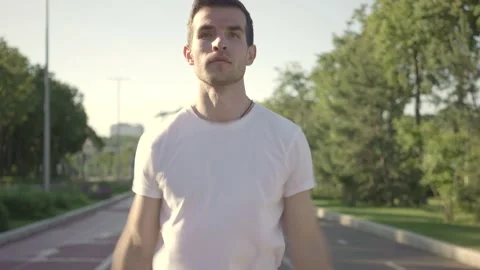 Fit young man preparing for workout doing stretching exercise for upper body Stock Footage 146305443