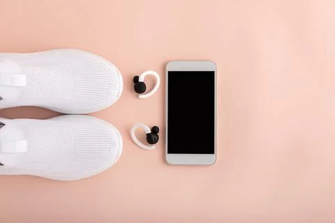 Fitness accessories on pink background preparing for workout Stock Photos