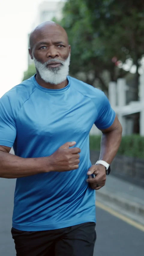 Fitness, active or old man in city with running, cardio or stamina exercise in Stock Footage 333667469