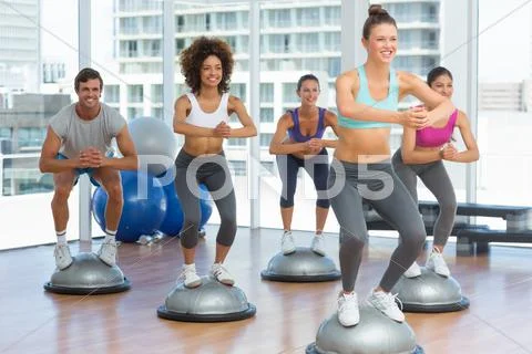 Fitness class and instructor doing pilates exercise Stock Photos