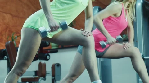 Fitness class doing exercises with dumbbells Stock Footage 100534762
