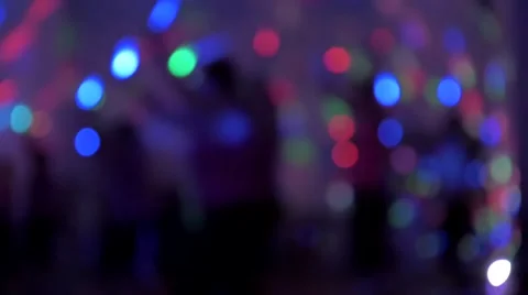 Fitness Class using glow sticks in a dark setting - Light Bokeh Stock Footage 67667017